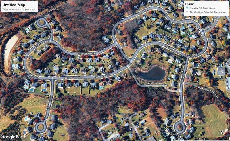 Aerial map view of a community of homes around a central pond