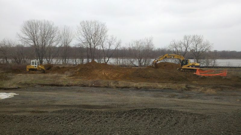 Excavators and a dozer on a large earthwork site