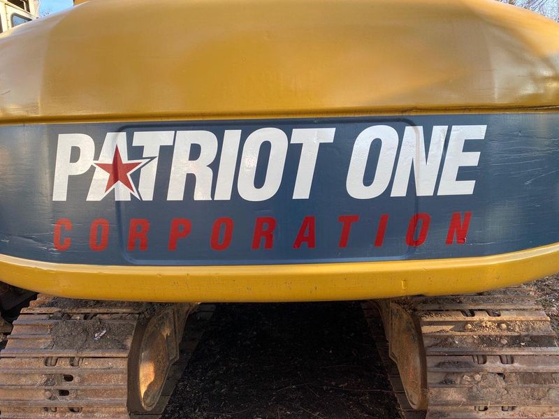 Patriot One Corporation logo on one of our excavators