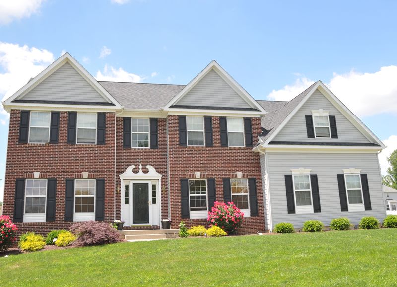 Colonial with a brick front and side-gabled wing