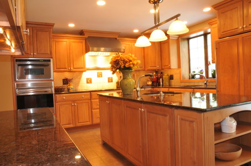 Kitchen with maple cabinets, granite counters and a center island
