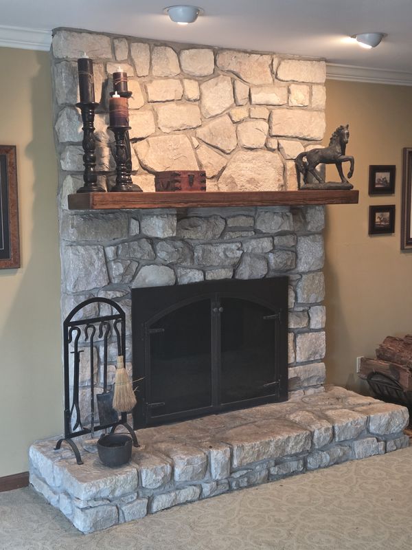 Real stone fireplace and raised hearth seen from the side